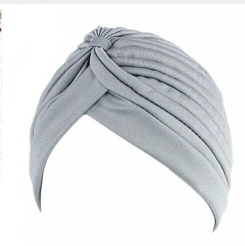 Stretchy women's turban cap with twisted pleats in assorted colors, stylish chemo beanie hat by Showlu Fashion Store.