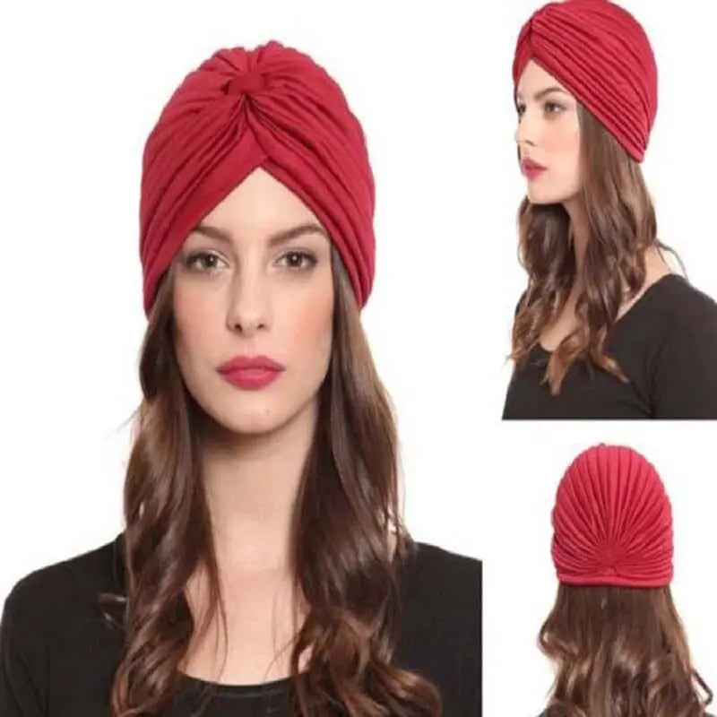 Stretchy women's turban cap with twisted pleats, chemo beanie hat in assorted colors, suitable for hair coverage and headwraps.