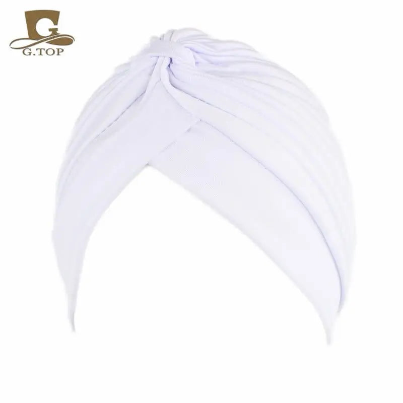 Stretchy women's turban cap with twisted pleated design in assorted colors, ideal as chemo beanie or stylish headwrap.