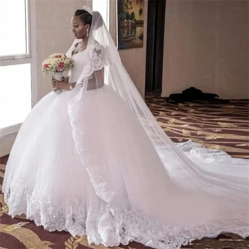 White NUO XI FANG V-Neck ball gown wedding dress with beaded lace appliques, sleeveless design, court train, plus size available.