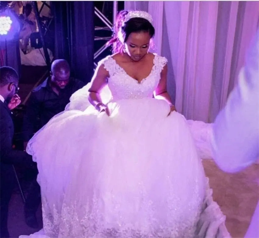 White NUO XI FANG V-Neck ball gown wedding dress with beaded lace appliques, sleeveless design, court train, plus size available