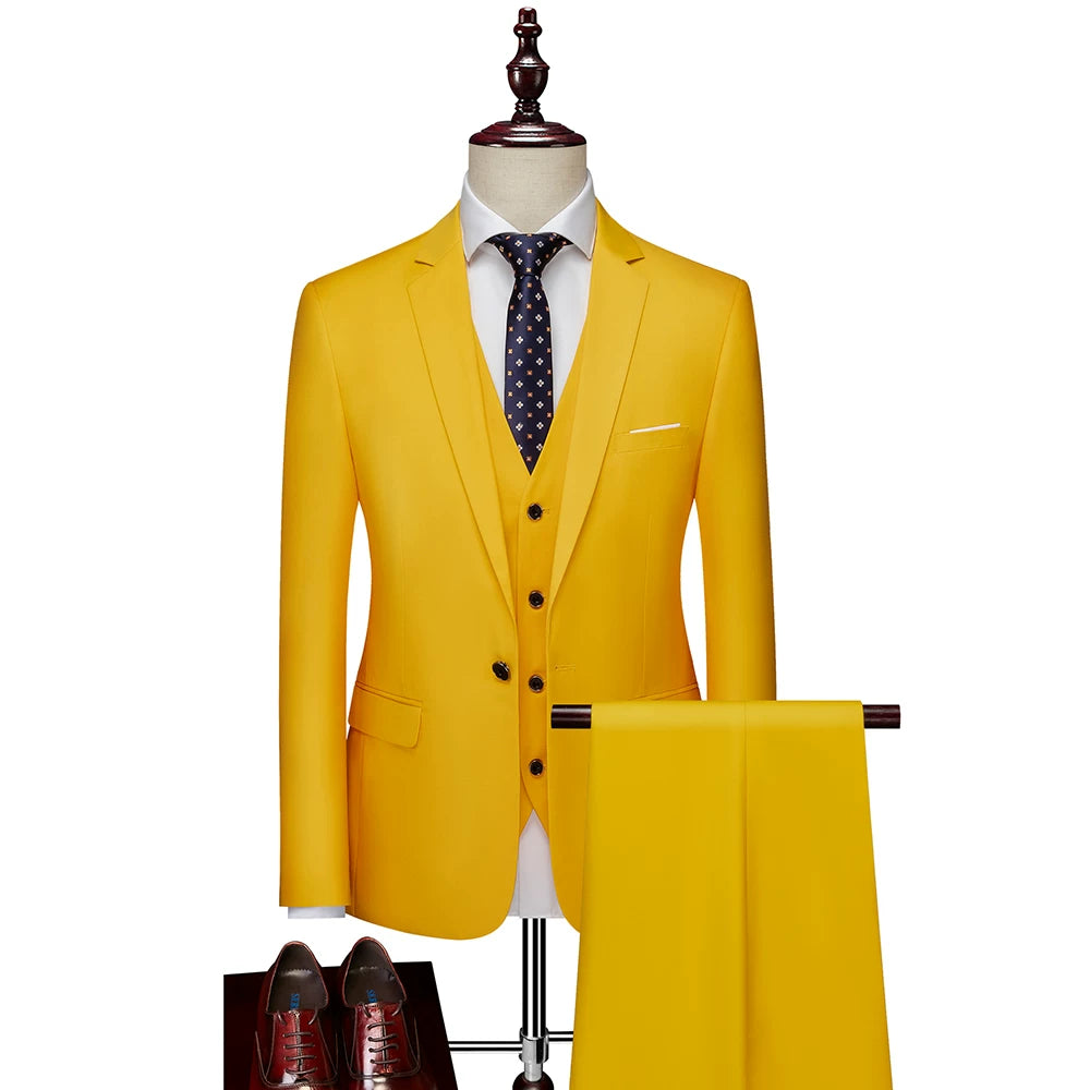 A bright yellow slim-fit three-piece suit with a white shirt and dark patterned tie.