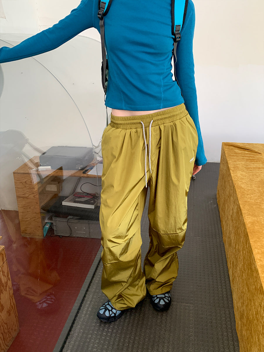 SHOWLU FASHION women's quick-drying loose side zipper leg pants shown on a model, lightweight and comfortable athletic wear.