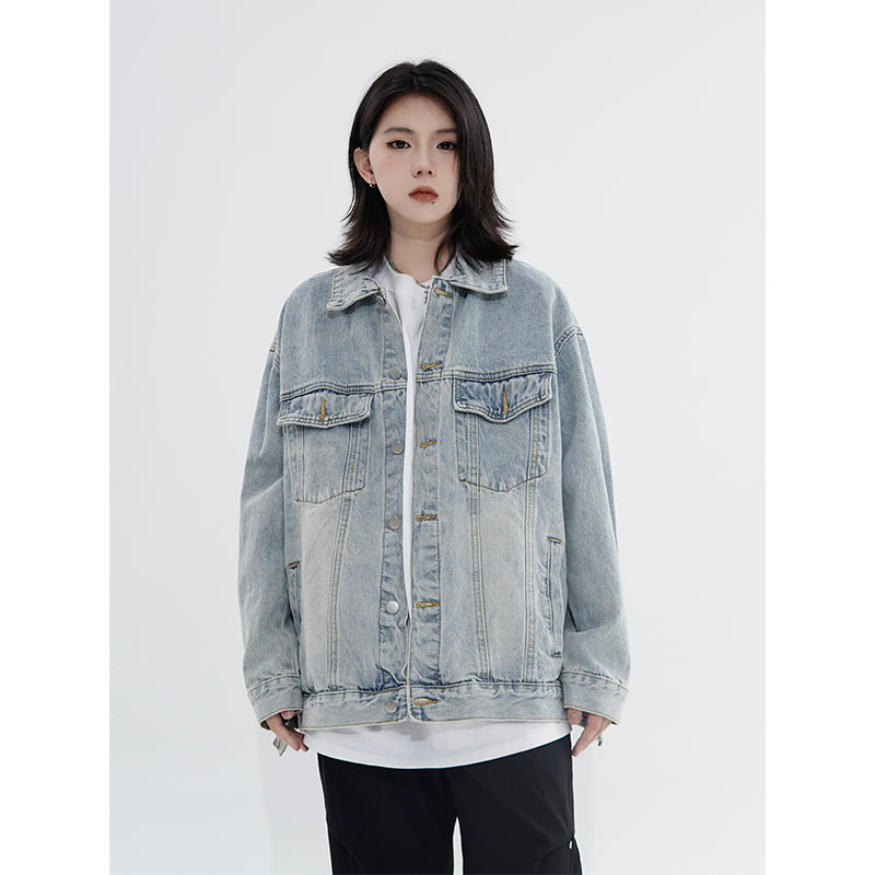 Vintage denim cowboy jacket with loose fit and polo collar, streetwear style by SHOWLU FASHION STORE, shown on a hanger.