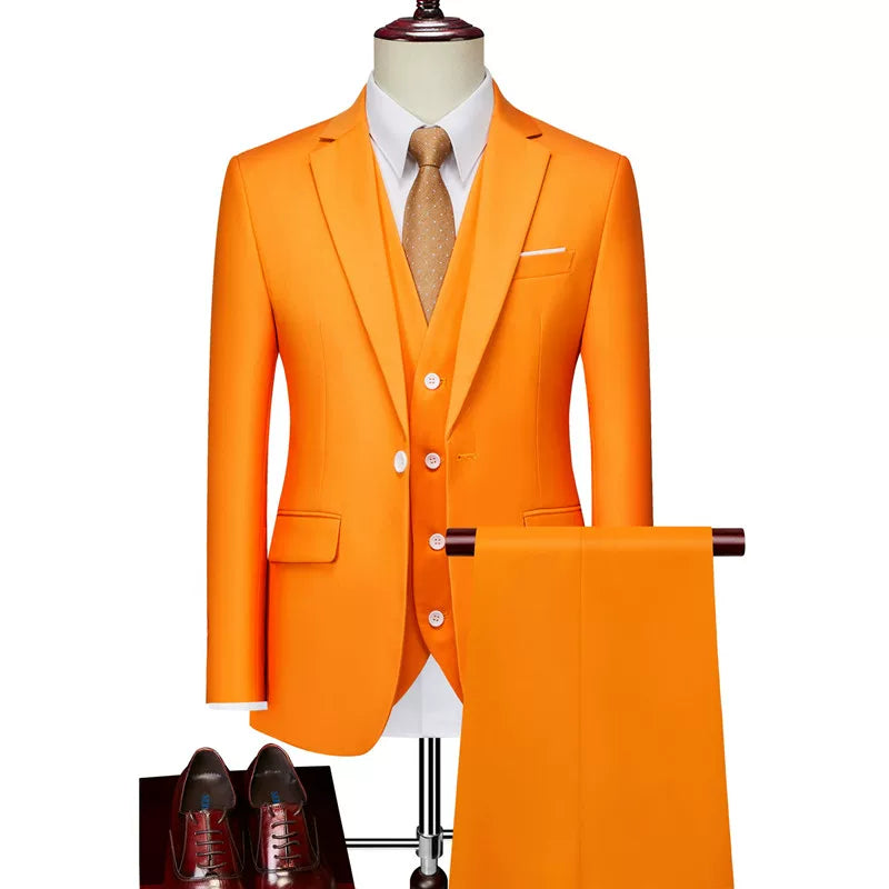 A vibrant orange slim-fit three-piece suit with a white shirt and brown dress shoes.