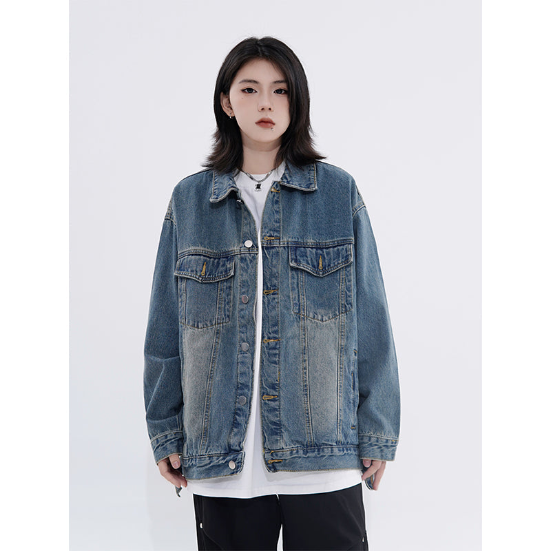 Vintage denim cowboy jacket by SHOWLU FASHION STORE, loose fit streetwear with cotton fabric and polo collar, shown on a hanger.