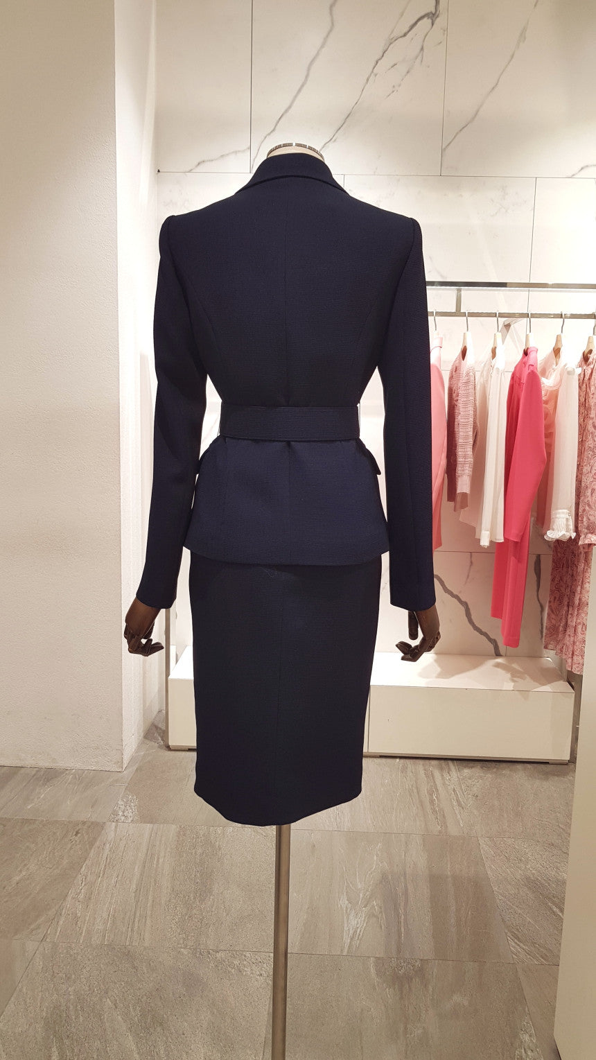SHOWLU Women's slim-fit double-breasted blazer jacket with belt, shown on a model, in a professional fashion setting.