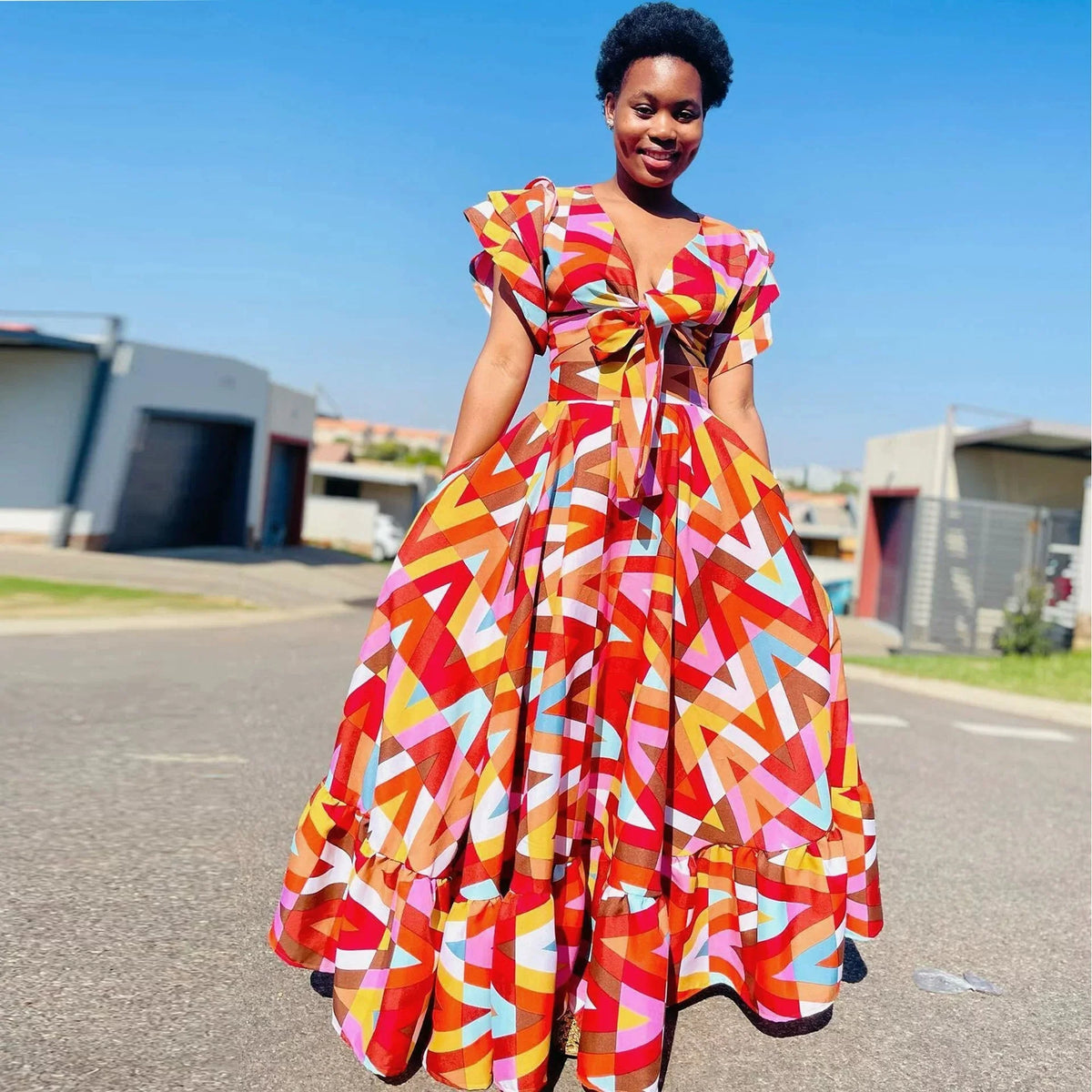 Plus size women's summer casual dress by SHOWLU FASHION with vibrant printed design and comfortable fit.