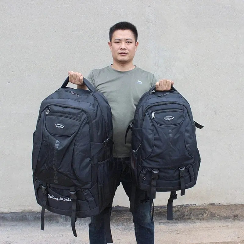 Large 70L waterproof hiking backpack by Showlu Fashion Store with multiple compartments, rugged design for trekking and camping.