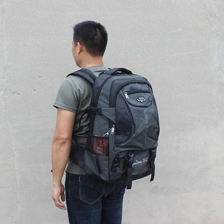 Large 70L waterproof hiking backpack from Showlu Fashion Store, designed for trekking, camping, and outdoor travel with wear-resistant material.