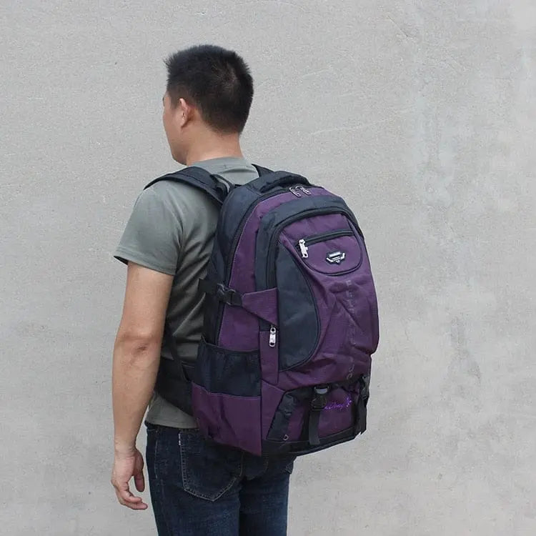 Large 70L waterproof hiking backpack by Showlu Fashion Store, with multiple compartments and rugged design for trekking and camping.