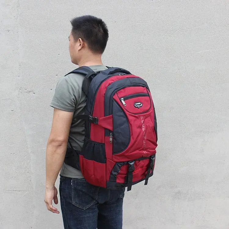 Large 70L waterproof hiking backpack by Showlu Fashion Store, with multiple compartments, rugged design, suitable for trekking and camping.