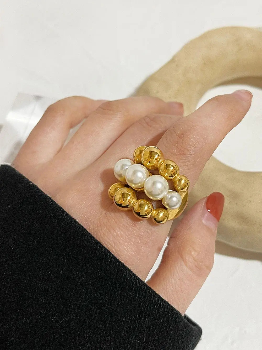 Gold plated stainless steel statement ring with faux pearls by Showlu Fashion, featuring a chunky design and bold style.