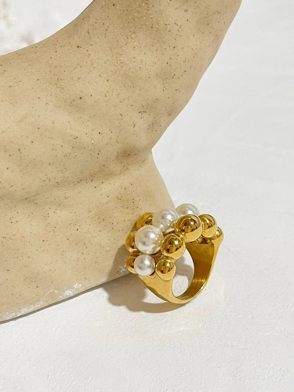 Gold plated stainless steel statement ring with chunky faux pearls, large ball design, perfect for bold jewelry looks.
