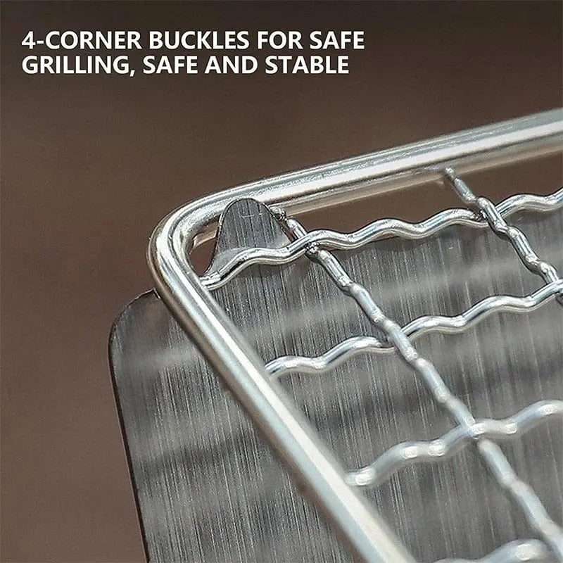Portable folding stainless steel camping BBQ grill and wood stove with a rack, ideal for outdoor cooking and camping.