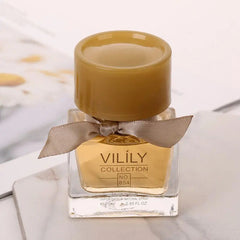 A small square glass bottle of Vilily perfume with a tan cap and a decorative ribbon.