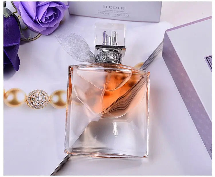 Vintage Showlu pocket spray perfume for women, 30ml European fragrance with orange and purple accents, compact and elegant design.