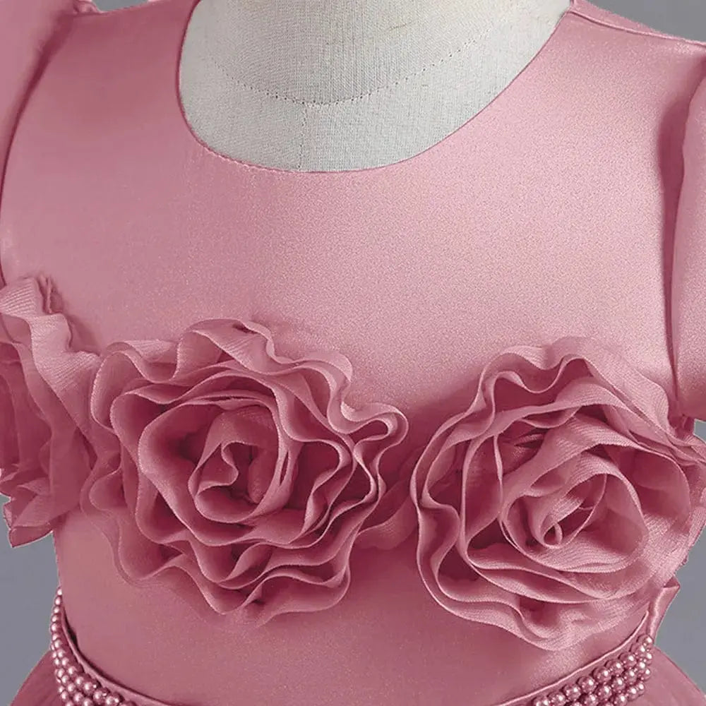 Pink puffy flower girl ball gown with ruffled sleeves and floral embellishments, perfect for princess pageants and special occasions.