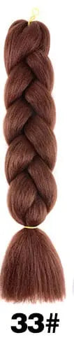 24-inch ombre pre-stretched Kanekalon jumbo braiding extensions from QP Hair, showcasing vibrant ombre color and thick, textured braids.