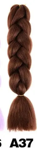 24-inch ombre Kanekalon jumbo braiding extensions, pre-stretched synthetic hair, shown in natural braid style with vibrant color.
