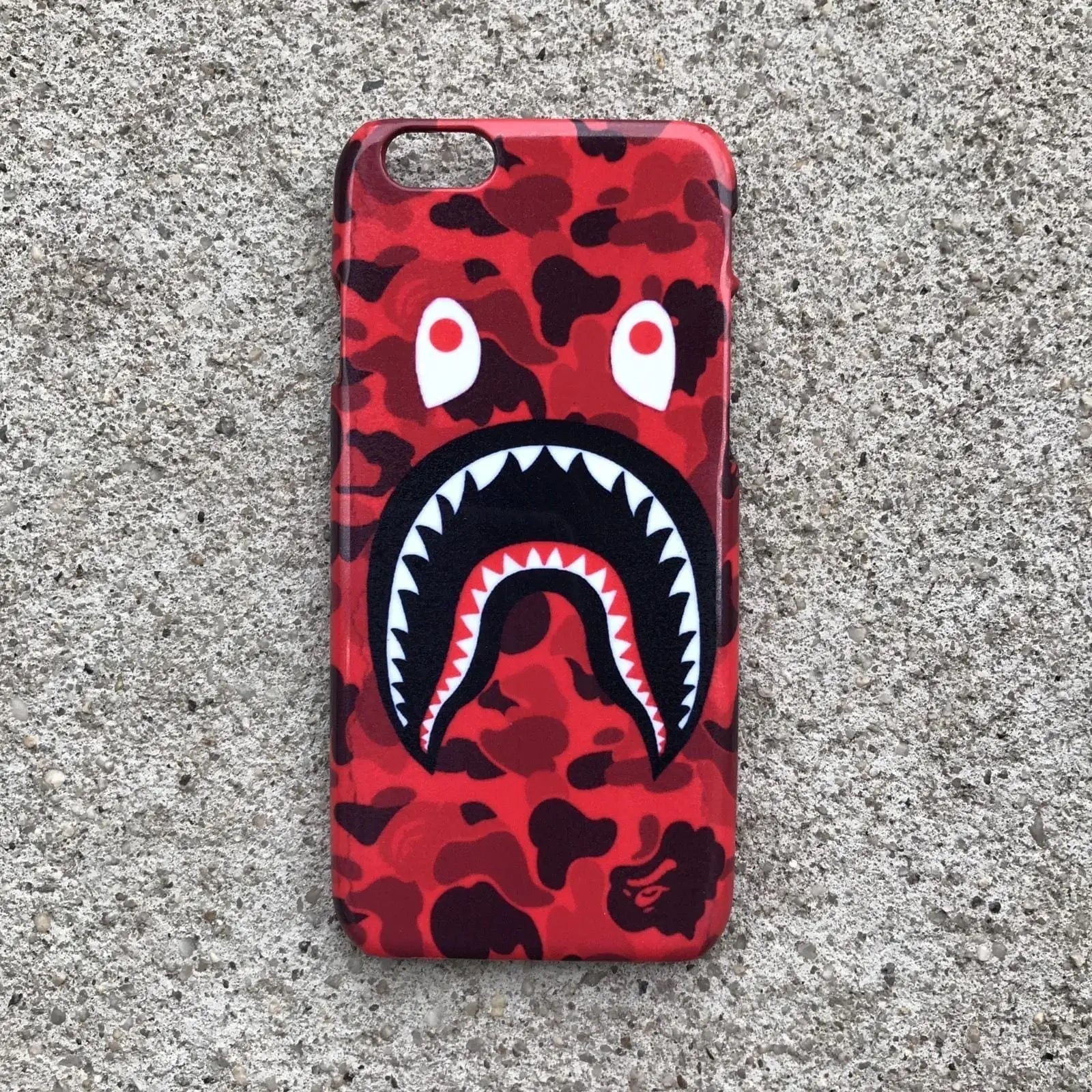 White Libra white TPU silicone iPhone case with red camouflage shark mouth design, durable and protective tech accessory.