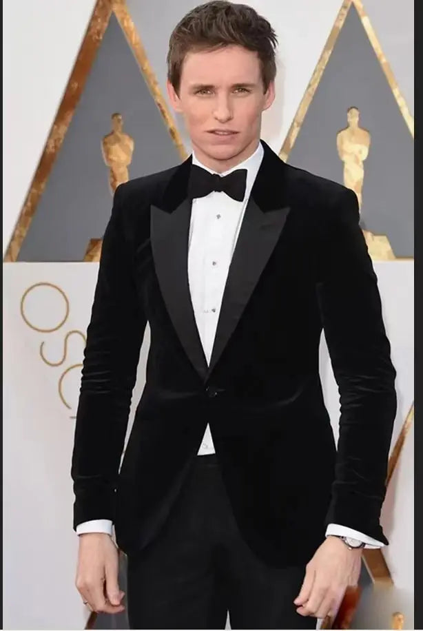 Black velvet smoking jacket for men with single-breasted peak lapels, slim fit blazer suitable for prom, wedding, or business events.
