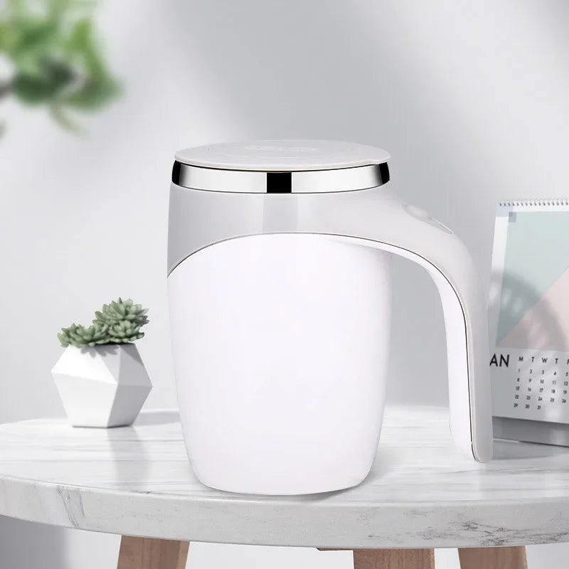 Rechargeable electric magnetic coffee stirring cup by Showlu Fashion, black with sleek design and touch control button.