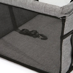 A grey foldable pet car seat with mesh sides and an internal safety tether.
