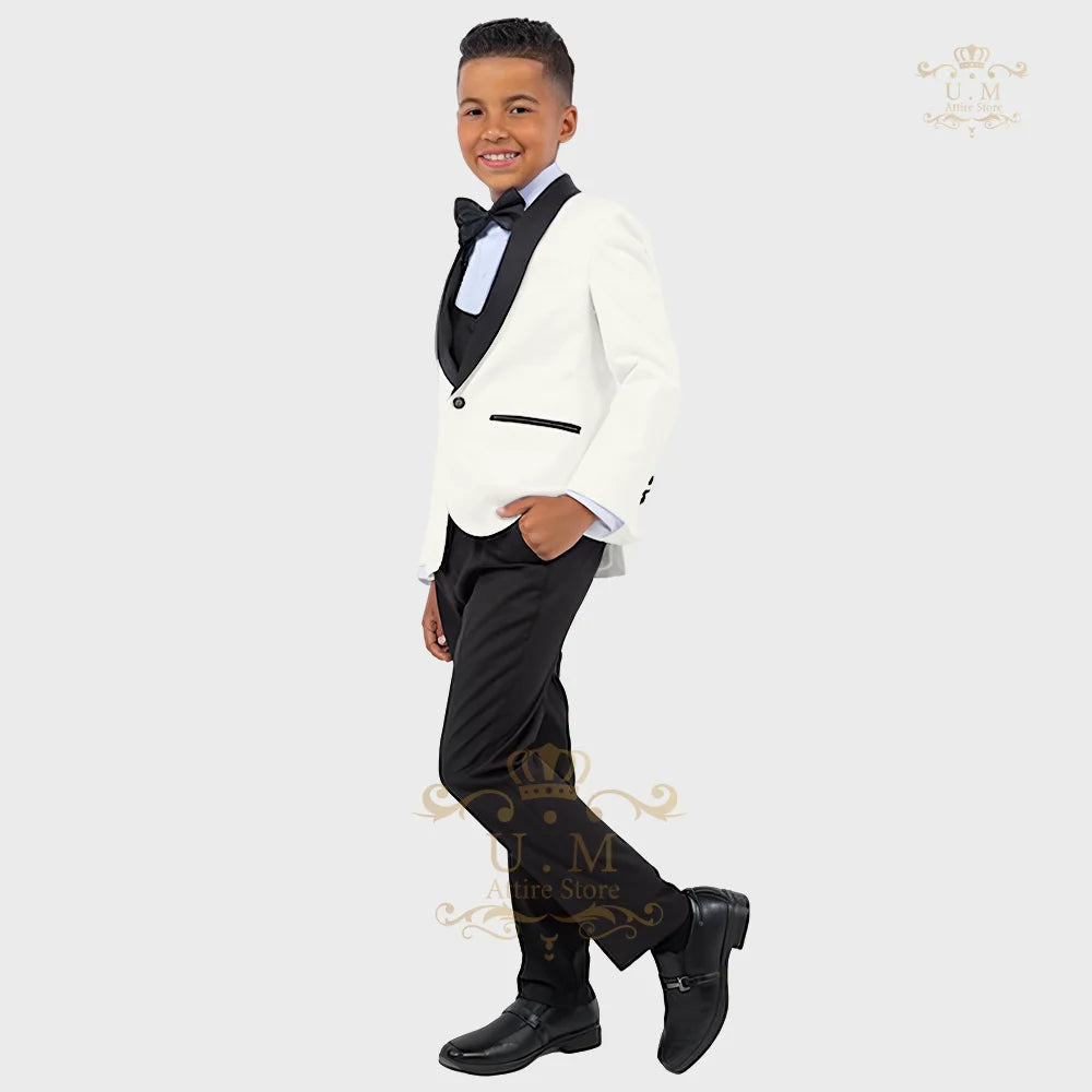 Boy wearing a white tuxedo suit with jacket, vest, and pants from SHOWLU FASHION STORE, formal attire for special occasions.
