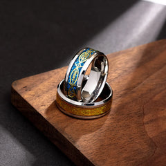 Two stainless steel rings with Jesus and fish motifs, one with blue and one with gold inlay.