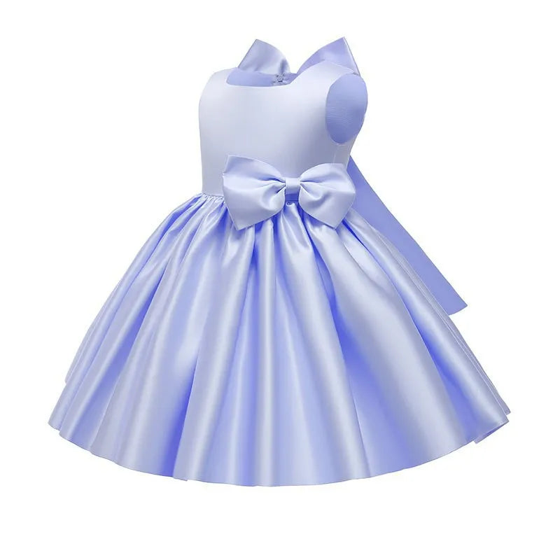 Pink princess dress for girls aged 1 to 8, Showlu Fashion, perfect for birthdays, baptisms, Christmas, with bow details and festive style.