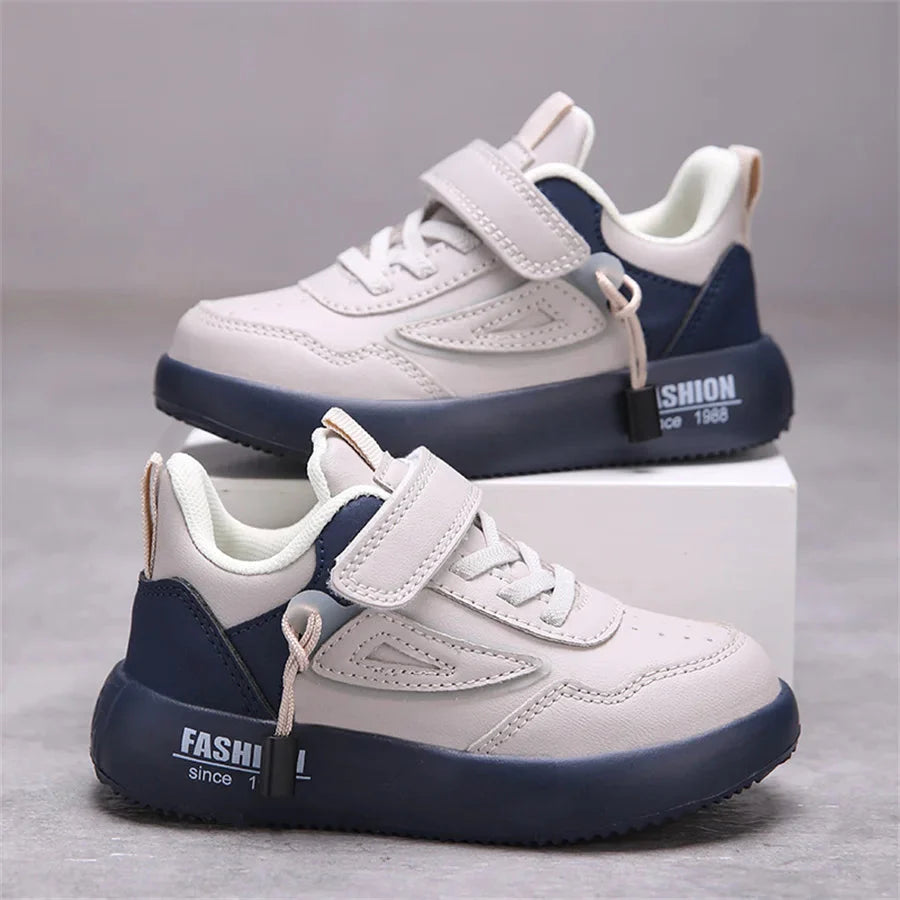 Kids white leather sneakers by SHOWLU FASHION STORE featuring breathable unisex casual sports shoes with comfortable design.