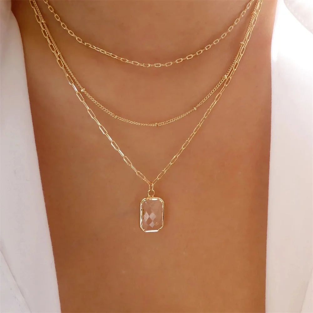 Elegant vintage round pearl pendant necklace for women, featuring multi-layer gold chain choker jewelry design.