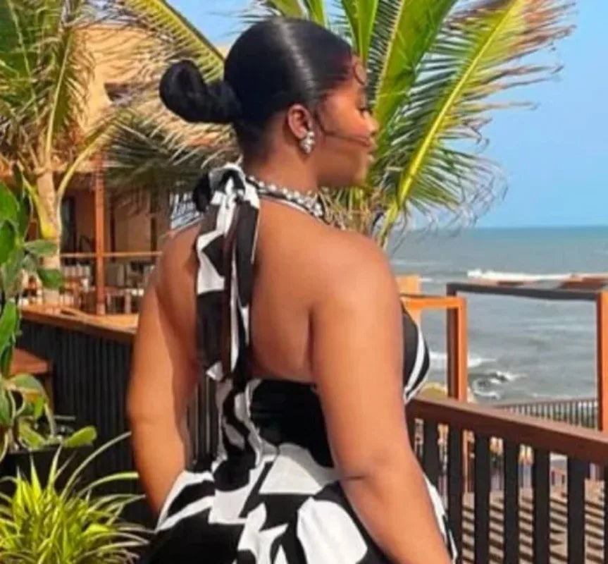 Women’s sleeveless V-neck halter midi dress with backless print, elegant design, perfect for beach parties and birthdays by Showlu Fashion.