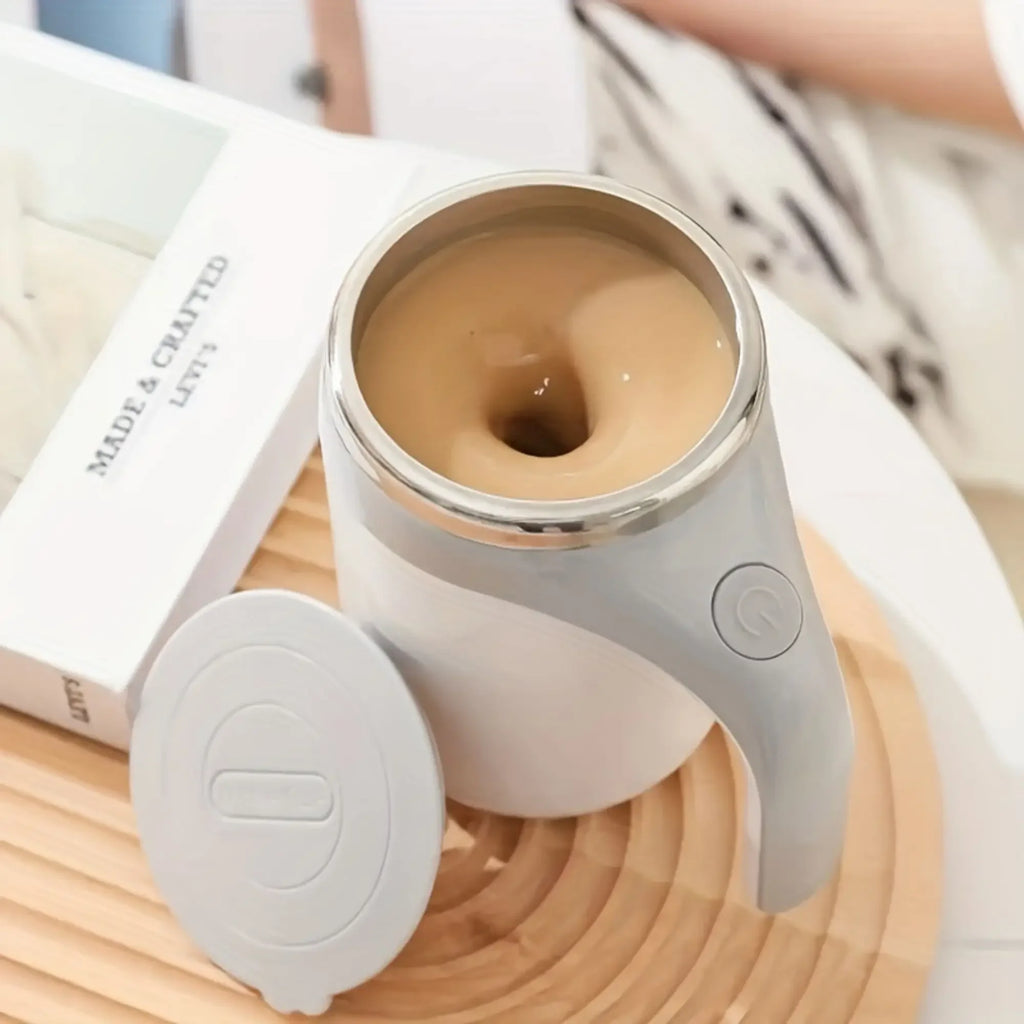 SHOWLU rechargeable automatic stirring coffee mug made of stainless steel, with a sleek design and built-in motor for easy mixing.