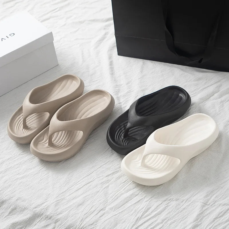 Women's thick platform EVA flip flops with soft cloud-like soles, perfect for beach and casual wear.