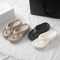 Women's thick platform EVA flip flops with soft cloud-like soles, perfect for beach and casual wear.