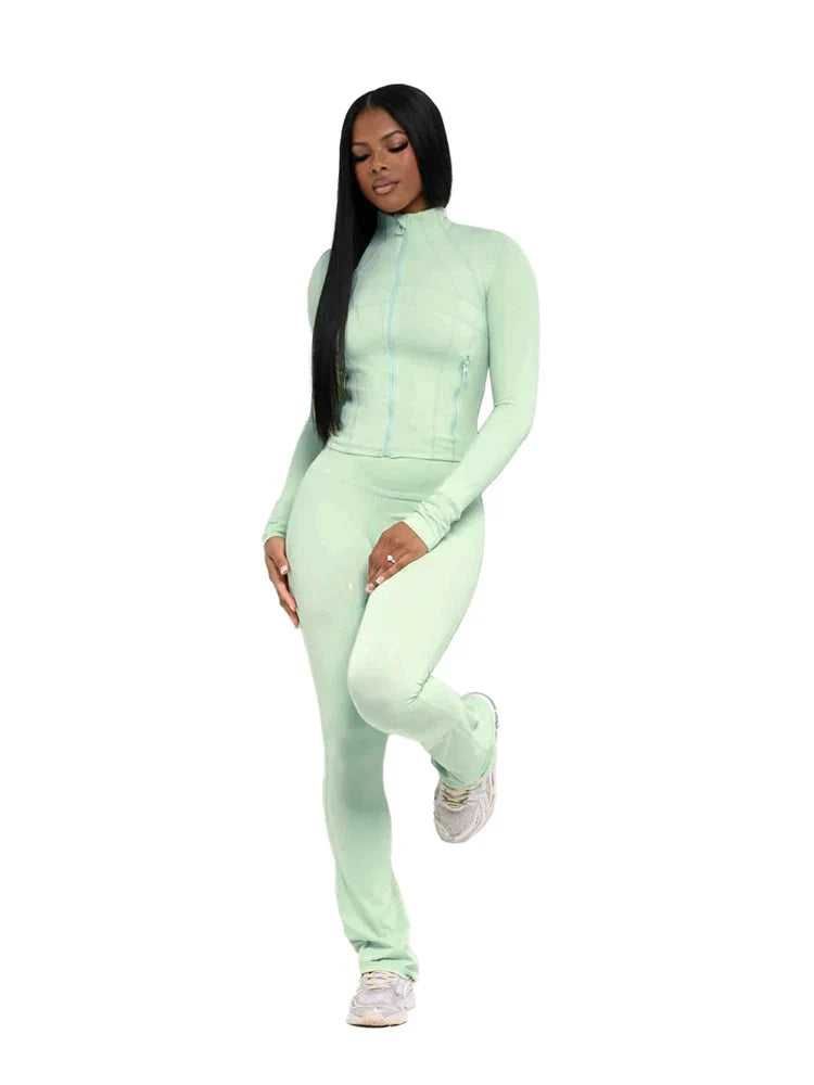 Women's two-piece tracksuit with flared pants and zip-up top by SHOWLU FASHION, shown in a stylish athletic wear set.