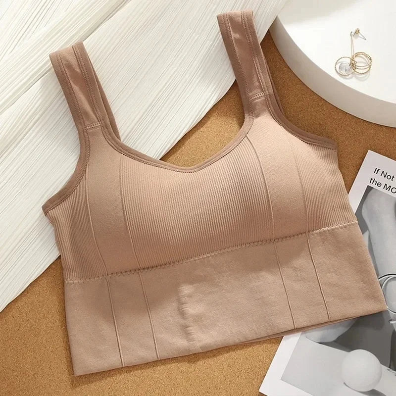 Seamless breathable sports bra for women with anti-sweat fabric, shockproof padding, and push-up design for gym and yoga workouts.