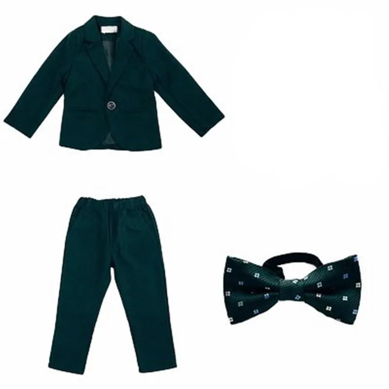 Dark green boys' formal wedding suit and tuxedo set by SHOWLU FASHION STORE, includes jacket, trousers, vest, and bow tie.