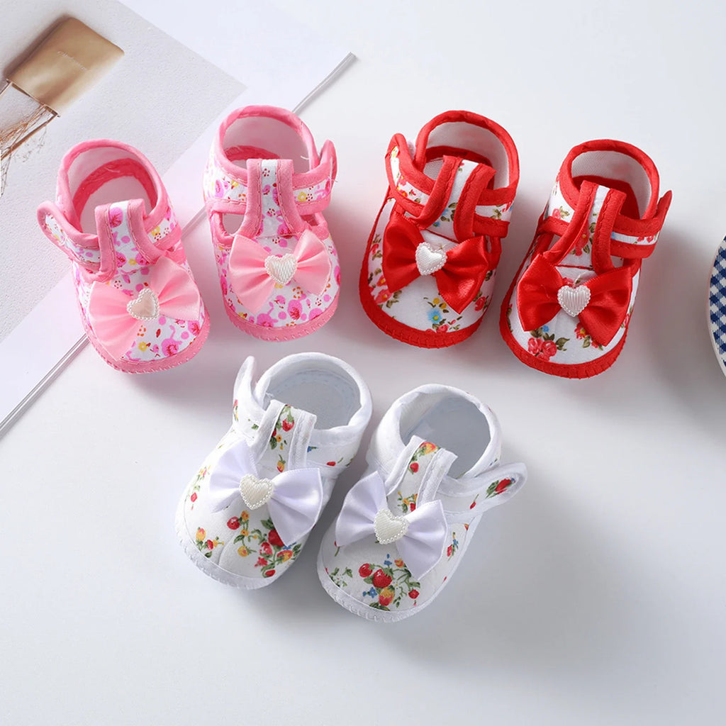 Showlu baby girls' soft sole flat shoes with flower print, toddler shoes for ages 0-12 months, comfortable and stylish.