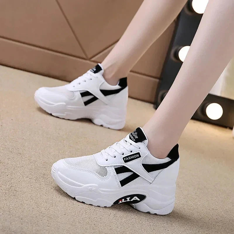 Showlu Fashion women's platform chunky sneakers with PU leather upper, lace-up design, and trendy chunky sole.