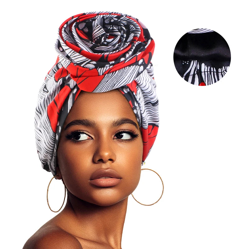 African satin-lined women’s turban cap with a large floral print and headwrap design, perfect as a Muslim headscarf or stylish bonnet.