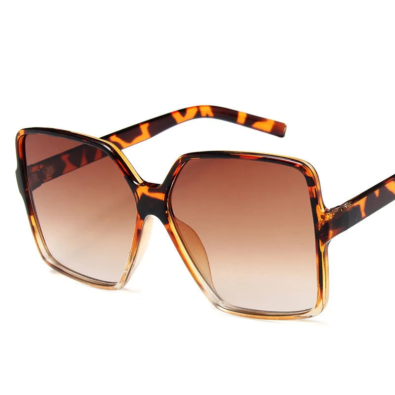 Showlu Fashion women's oversized sunglasses with gradient plastic lenses, UV400 protection, stylish designer sun glasses.