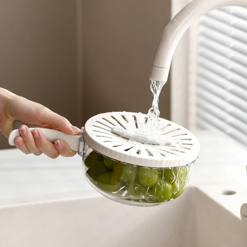 SHOWLU Folding Drain Basket with Lid, a plastic fruit and vegetable colander for rinsing and draining produce efficiently.
