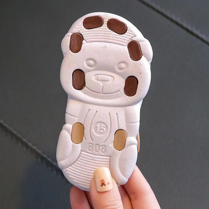 Showlu Baby open-toe clogs with anti-slip soft soles, designed for infants' comfortable and safe walking.
