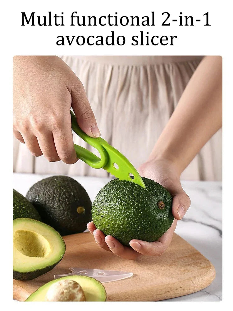 Showlu Smart General 3-in-1 avocado tool with stainless steel pitter, slicer, and scoop, shown on a kitchen countertop.