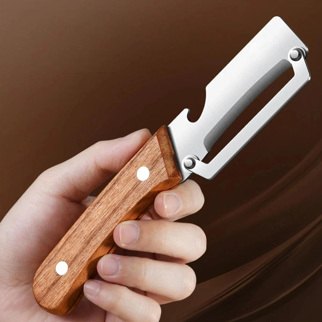 Stainless steel peeler with wooden handle for peeling fruits and vegetables, showing its durable construction and smooth operation