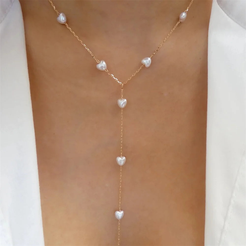 Elegant vintage pearl necklace for women with gold multi-layer chain and round pendant, stylish fashion jewelry.
