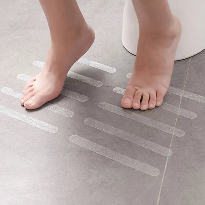 Showlu Smart General anti-slip shower stickers on a bathroom floor for safety and traction in wet conditions.
